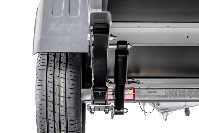 Autotransportanhänger auf Blattfedern 264×125 UNITRAILER GARDEN 264/R KIPP mit Gitterwänden, H-800 Rahmen und grauer Plane-Neu