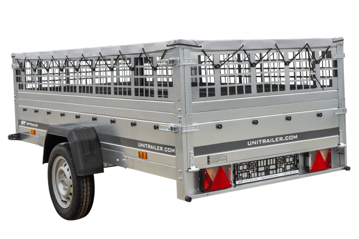 Einachsiger Anhänger auf Blattfedern 264×125 UNITRAILER GARDEN 264/R KIPP mit Gitterseitenwänden, H-0-Rahmen und grauer Plane-Neu